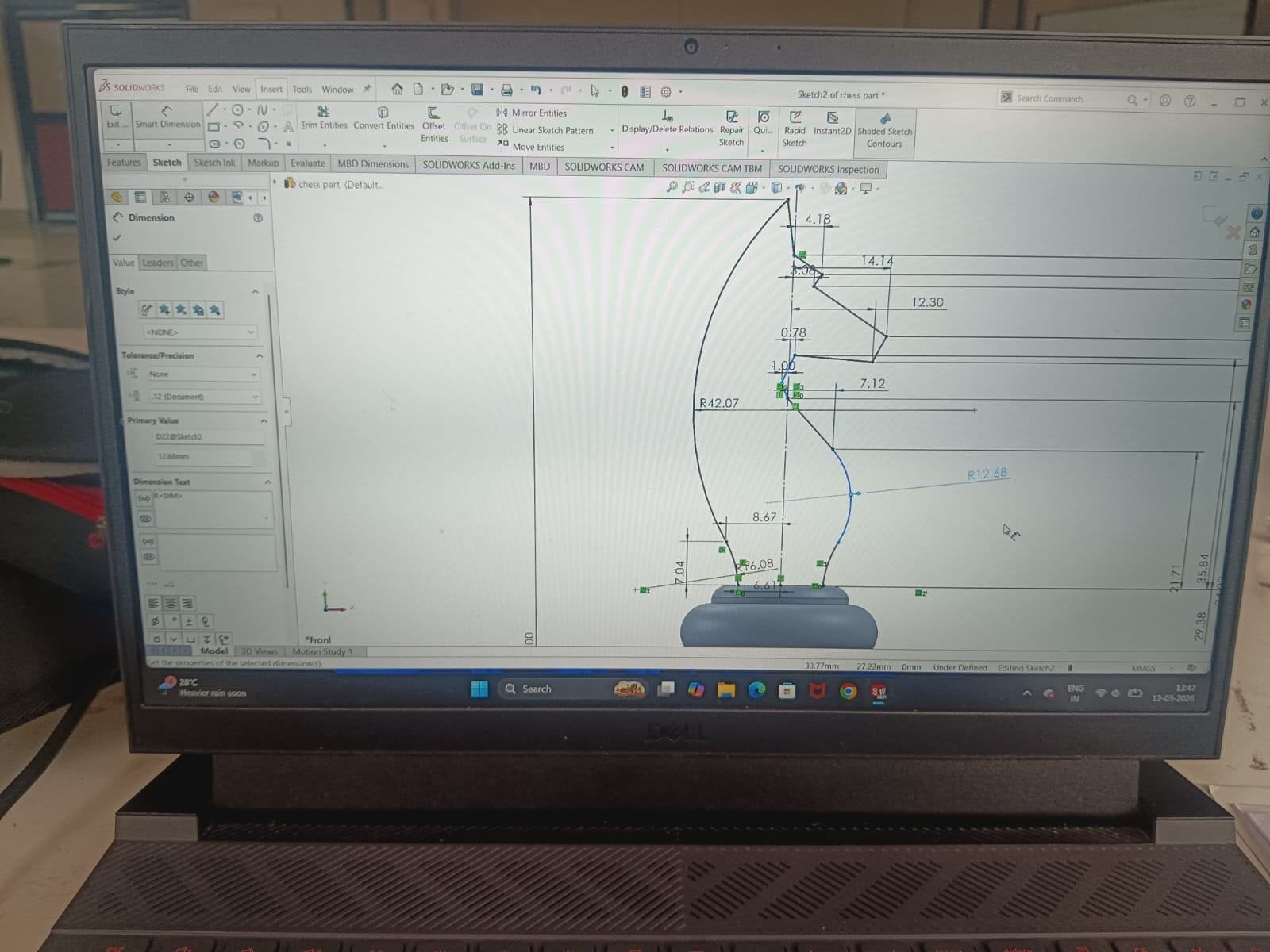 The knight profile being drawn in SolidWorks on a laptop screen