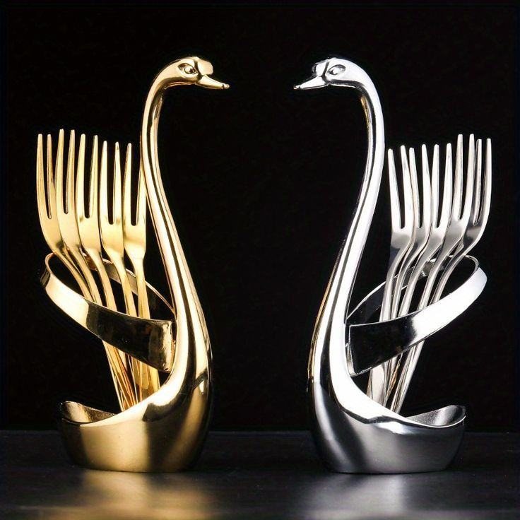 Gold and silver swan-shaped cutlery holders