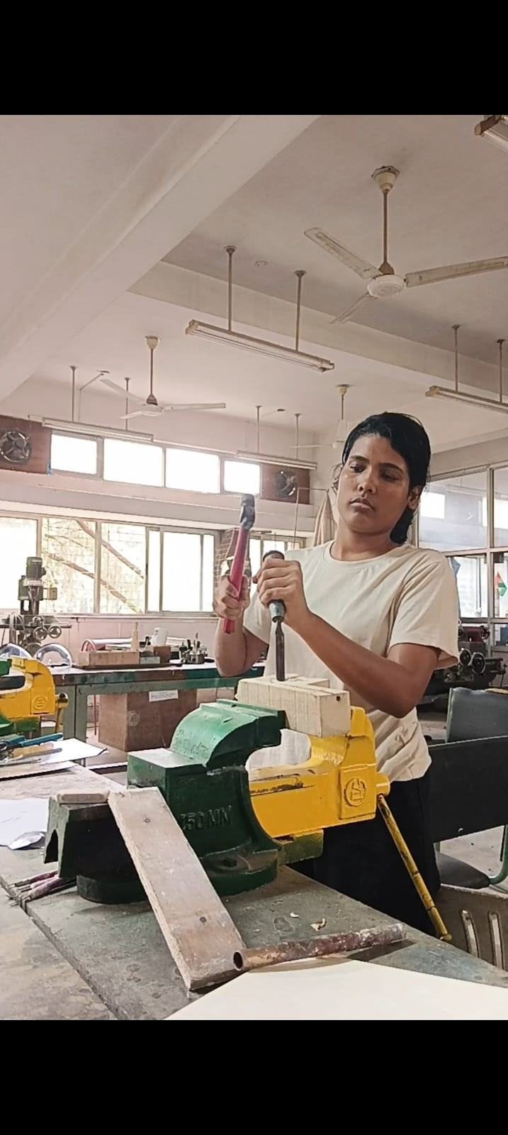 Working at the bench vice in the workshop