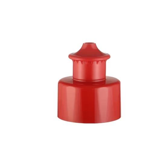 A red push-pull sports bottle cap