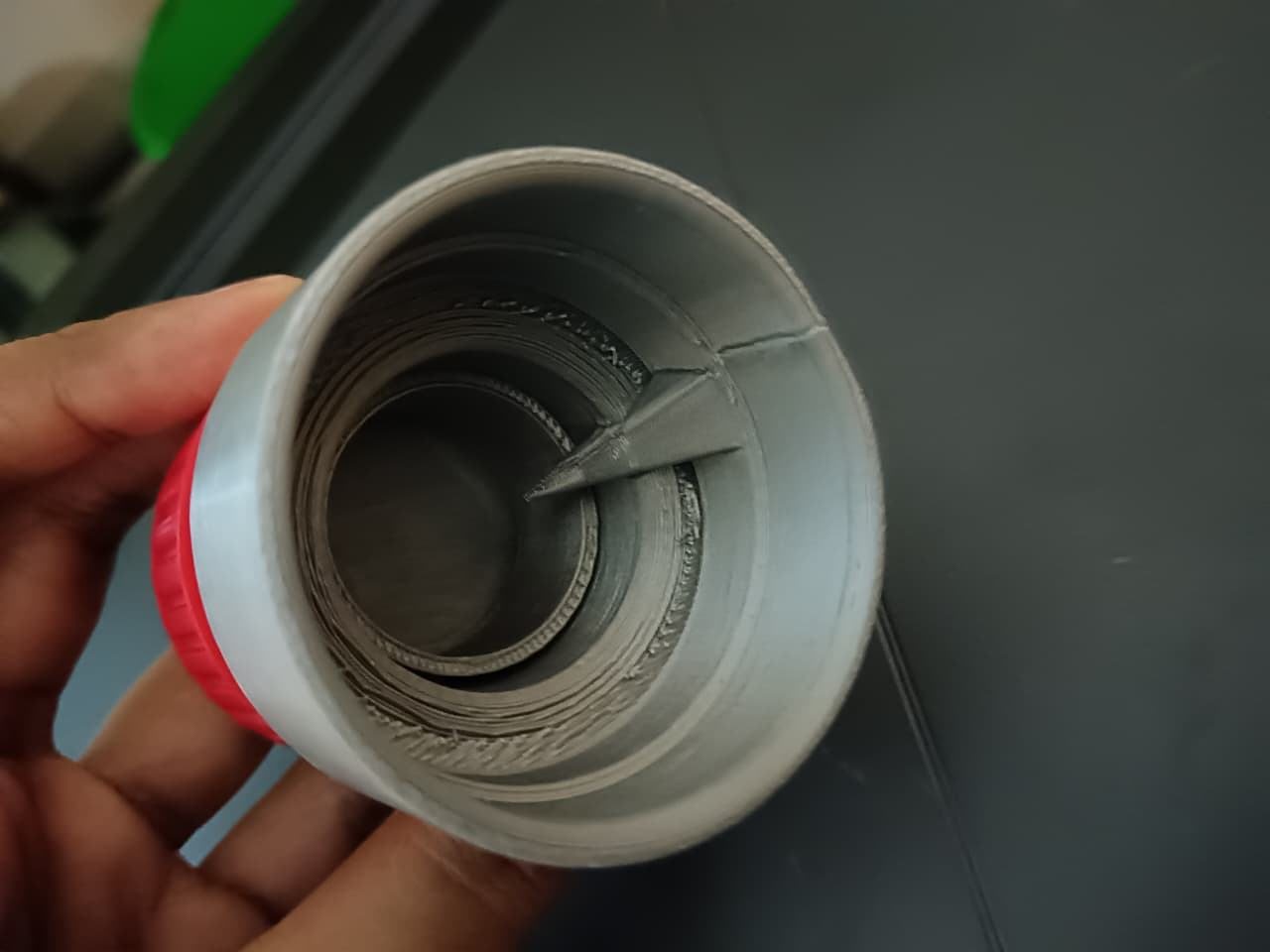 Inside of the silver cap showing the internal ring mechanism