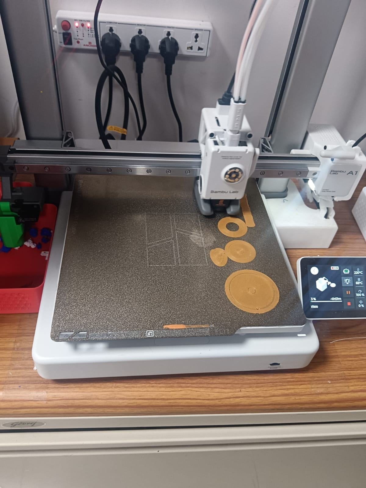 The printer working on the orange frame and cam parts